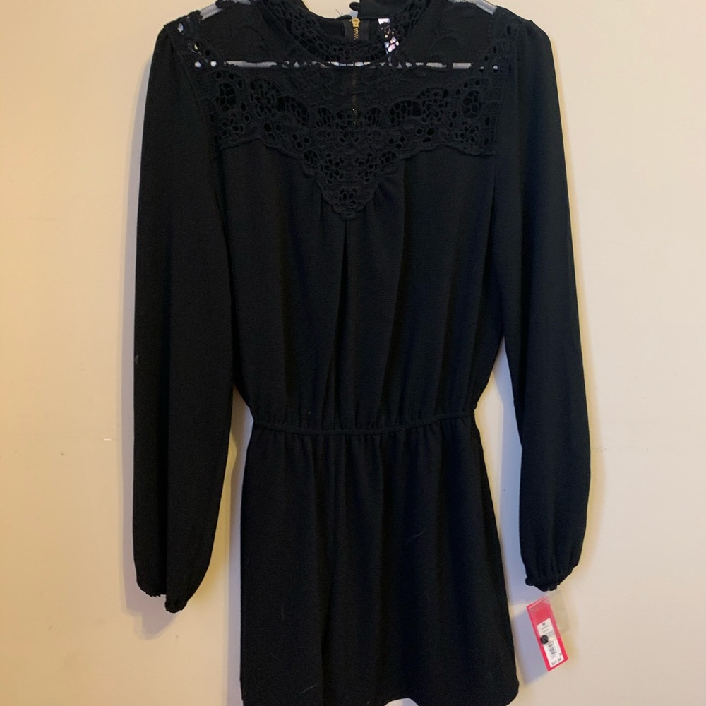 Black Romper! Beautiful lace detail on top!